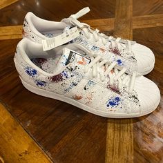 Adidas Superstar Paint Splatter (New) Color: White Size: 13 Sporty Sneakers With Paint Splatter And White Sole, Casual Sneakers With Paint Splatter And White Sole, White Sole Sneakers With Paint Splatter And Round Toe, Casual White Sneakers With Paint Splatter, White Paint Splatter Sneakers With Round Toe, Adidas Custom Sneakers With Speckled Midsole For Sports, Multicolor Sneakers With Paint Splatter And Round Toe, White Custom Sneakers With Paint Splatter For Sports, Sporty Adidas Custom Sneakers With Speckled Midsole