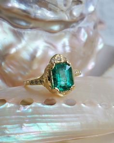 * guided by love* _________ ONE OF A KIND Can be sized from 4 - 8. Please put your desired size in notes section 18k Yellow Gold Set w/ 1.43ct Columbian Emerald approx 7.81 x 5.85 x 4.44mm (6) 1.1mm White Diamonds Accent stones on (3) on each side of diamonds & (3) 1.1mm on top of Emerald *Emeralds *The presence of inclusion and imperfections are natural and add to their character, which so many people are drawn to. Luxury Diamond Ring With Emerald Accent Stones, Timeless Emerald Ring With Accent Stones As Gift, Luxury Emerald Ring With Accent Stones, Heirloom Emerald Ring With Accent Stones For Gift, Heirloom Emerald Ring With Accent Stones As Gift, Timeless Emerald Ring With Center Stone As A Gift, Luxury Emerald-cut Jewelry As A Gift, Handmade Luxury Emerald Ring, Luxury Emerald Cut Jewelry Gift