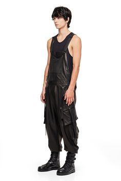 One piece, suit up. Leather Overalls have arrived this season, crafted from the most luxe Cabreta leather with minimal tonal hardware. — Front pocket at chest— Dual asymmetrical button slash pockets at hip— Single cargo pocket on each leg— Single pocket on back.— 100% Cabreta leather; satin lined SIZE + FIT— Loose, tapered, drop fit— Elastic cuffs— Model is 6'1 and wearing a size L CARE— Spot and specialty clean only Leather Overalls, Cargo Jumpsuit, Leather Suit, Jumpsuit Men, Suit Up, Design Competitions, Cargo Pocket, One Piece Suit, Steampunk Fashion