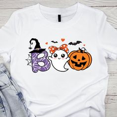 Ghost Boo T- shirt, Boo Ghost Girl  T-shirt , Halloween  Shirt, Cute Spooky. Our personalized t-shirts are made from high-quality materials that feels great against your skin. With a range of colors and designs to choose from, you're sure to find a shirt that matches your personality and style. Whether you're looking for a funny graphic tee, a statement piece with bold, eye-catching artwork, or a classic design with a twist, we have something for everyone. Perfect for casual outings, concerts, o Themed White T-shirt For Fall, Themed White T-shirt With Letter Print, White Novelty T-shirt With Custom Print, Halloween White T-shirt With Sublimation Print, White Halloween T-shirt With Sublimation Print, Novelty White T-shirt For Halloween, Halloween Custom Print White T-shirt, White Halloween T-shirt With Custom Print, Fun White Halloween T-shirt