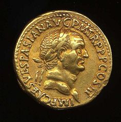 an ancient gold coin with a man's head on it, and the words