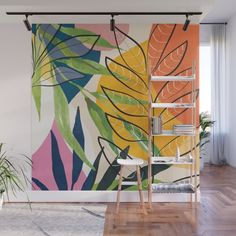 a colorful tropical wall mural with palm leaves