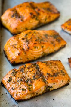 salmon fillets on a baking sheet ready to be cooked in the oven for dinner