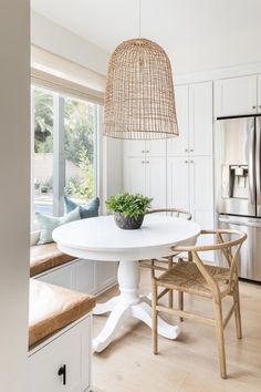 a white table and chairs in a room