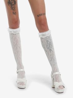 Complete your coquette look with these adorable white socks. These over-the-knee socks have a pointelle design and feature white ruffle lace detailing up at the top.One size fits mostPolyesterWash cold; dry lowImported White Fluffy Shoes, Lace Knee Socks, Cute White Knee-high Socks, Coquette Knee Socks, White Lace Socks, White Lace Knee High Socks, White Ruffle Socks, White Harajuku Thigh-high Socks, Long White Socks