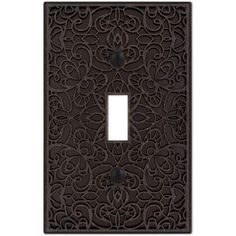 a decorative light switch cover with an intricate design