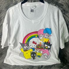 Brand New With Tags Smoke And Pet Free Home Sanrio Shirt With All The Characters: Kuromi, My Melody, My Little Twin Stars, Hello Kitty, Badzmaru, Pompompurin, Keroppi, Hamburger I Have Multiple Sizes Available! Please Check Out My Other Listings To Save On Shipping! Feel Free To Ask Questions And Make Reasonable Offers Through The “Make An Offer Button” Playful Hello Kitty T-shirt For Summer, Cute Multicolor Graphic Print T-shirt, Multicolor Kawaii Tops With Letter Print, Hello Kitty Fun Crew Neck Top, Hello Kitty Crew Neck Fun Tops, Multicolor Hello Kitty Print Short Sleeve Tops, Multicolor Kawaii T-shirt For Spring, Fun White Top With Cartoon Print, White Fun Tops With Cartoon Print