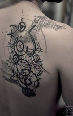 the back of a man's shoulder with an abstract design on it