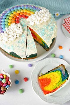 there is a cake that has been decorated with rainbows and sprinkles