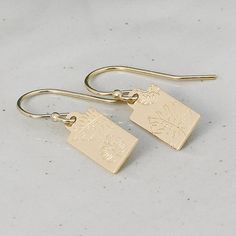 These Monstera Leaf Earrings bring a subtle botanical touch to your style with petite tags in either gold filled or sterling silver. Choose from classic french hook or lever back earwires for a perfect fit. A great gift for young adults or for stacking with multiple earrings, these dainty, minimalist designs bring a touch of nature to your look. *Handcrafted from sheet metal - 6x12mm Rectangular Tag *Approximate Drop Length: 1 to 1 1/8" depending on choice of ear wire *Satin finish 14/20 Gold Fi Dainty Yellow Gold Earrings With Birth Flower, Dainty Yellow Gold Birth Flower Earrings, Delicate Yellow Gold Birth Flower Earrings, Elegant Birth Flower Earrings For Everyday Wear, Everyday Elegant Birth Flower Earrings, Elegant Everyday Birth Flower Earrings, Minimalist Everyday Earrings With Flower Charm, Everyday Minimalist Earrings With Flower Charm, Gold Botanical Dangle Earrings