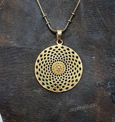 HANDMADE Stunning statement Star Mandala, sacred geometry pendant with a complementary chain. Made by hand with hight quality of brass, Nickel free.  SIZE Aprox pendant height: 5 cm Aprox Pendant Width: 3.7 cm LINK Don't miss the rest of the collection, please follow the link.  https://www.etsy.com/uk/shop/JagathaStudio Gold Spiritual Brass Necklaces, Brass Medallion Necklace For Rituals, Antique Gold Brass Necklace For Rituals, Gold Brass Spiritual Medallion Necklace, Gold Spiritual Medallion Necklace In Brass, Symbolic Handmade Gold Medallion Necklace, Spiritual Brass Pendant Necklace, Brass Pendant Necklace For Festivals, Spiritual Brass Jewelry With Oxidized Finish