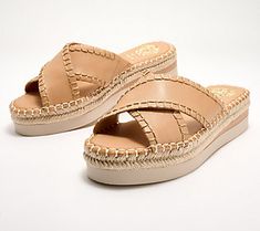 Hello, sunny-season slides! Better get comfy greeting these crossband sandals on the regular. Their leather crisscross bands, jute-wrapped bottom, and espadrille vibe scream summer style. You'll be spotted everywhere in this go-anywhere pair. From Vince Camuto. Espadrille Sandals For Spring Outings, Espadrille Sandals For Spring, Summer Vacation Cross Strap Wedge Sandals, Cross Strap Wedge Sandals For Summer Beach, Cross Strap Wedge Sandals For Beach In Summer, Summer Cross Strap Wedge Sandals For Beach, Comfortable Wedge Sandals With Leather Footbed For Summer, Trendy Spring Wedge Sandals With Leather Footbed, Summer Beach Sandals With Cross Strap