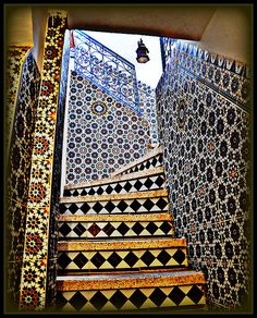 the stairs are decorated with mosaic tiles