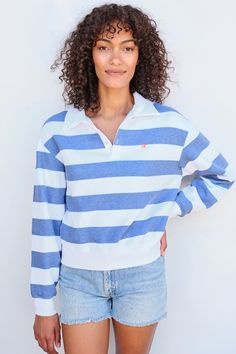 Our rugby style top is the cutest with its johnny collar, sail embroidery and nautical stripes. Blue Tops With Striped Collar In Sporty Style, Navy Cotton Top With Striped Cuffs, Sailor Style Striped Long Sleeve Top, Sailor Striped Long Sleeve Top, White Polo Collar Top With Striped Cuffs, Striped Sailor Long Sleeve Top, Preppy Tops With Striped Polo Collar, Preppy Polo Collar Top With Striped Details, Preppy Top With Striped Polo Collar