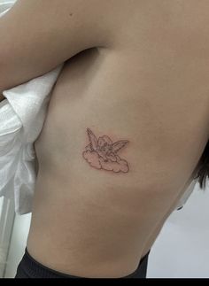 a woman with a small tattoo on her stomach