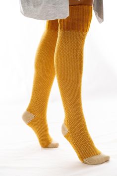 Lounging never looked so cute! These knitted lounge socks feature contrasting color detailing at the toes and heel with a large ribbed band at the top. Pull them up or shrug them down for a look that's cozy, comfortable and cabin approved. Model is 5'10" wearing a One Size. 100% Acrylic Import Cozy Comfortable Knee-high Socks For Stocking Stuffers, Cozy Knitted Knee-high Socks, Cozy Comfortable Knee-high Socks, Cozy Warm Knit Knee-high Socks, Comfortable Cozy Knee-high Socks, Cozy Knee-high Knit Socks, One Size Knitted Mid-calf Socks, Comfortable Warm Knit Socks, Comfortable Soft Knit Socks For Fall