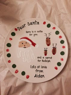 a christmas plate with santa and reindeers on it, which reads dear santa here is a cookie for you and a carrot for rudolph lots of love from alden