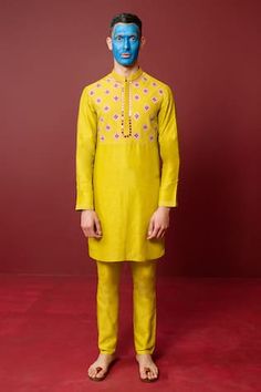 Sunflower mustard kurta with resham hand embroidery. Comes with tonal pant.
Components: 2
Pattern: Hand embroidered
Type Of Work: Resham
Neckline: Mandarin collar
Sleeve Type: Full
Fabric: Viscose raw silk, Pure cotton voile
Color: Yellow
Other Details: 
Length:
Kurta: 40 inches
Pant: 40.5 inches
Closure: Kurta - Front buttons
Occasion: Sangeet - Aza Fashions Mustard Resham Embroidery Kurta For Eid, Yellow Churidar With Gota Work For Puja, Festive Mustard Kurta With Resham Embroidery, Mustard Straight Kurta For Diwali, Mustard Straight Kurta Set For Eid, Yellow Resham Embroidered Kurta For Festive Season, Yellow Churidar With Floral Embroidery For Eid, Festive Mustard Straight Kurta, Traditional Spring Yellow Kurta