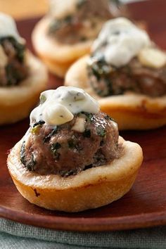 small appetizers with meat and cheese are on a plate