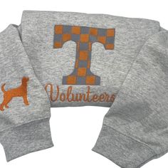 The Tennessee varsity embroidered sweatshirt is made from a cozy cotton poly blend that is perfect for game day. The material is soft and comfortable making it ideal for wearing all day long. The varsity embroidery adds a stylish touch to the sweatshirt making it a great addition to any wardrobe. Whether you're cheering on your team at the game or just hanging out with friends this sweatshirt is sure to keep you warm and looking great. Get yours today and show your team spirit in style! Collegiate Sweatshirt With Embroidered Graphics, Sporty Embroidered Logo Sweater For Fall, Sporty Fall Sweater With Embroidered Logo, Cotton Sweats For Campus Wear In Fall, Game Day Fall Crew Neck Sweatshirt, Game Day Crew Sweatshirt For Fall, Collegiate Crew Sweatshirt For Fall, Fall Game Day Crew Sweatshirt, Collegiate Fleece Sweater For Fall