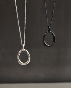 This is a chain necklace with an oval pendant that has an irregular, organic shape. The pendant is made of 925 silver, with a matte finish and uneven surface texture, giving it a unique and handmade look. It is strung on a sterling silver chain which has a simple design with subtle links that complement the signature pendant without overpowering it and fastens with a handmade hook clasp. Available in silver and oxidized finish. COMBINATION WITH OTHER  NECKLACES: This 21.5 inch necklace can also Minimalist Sterling Silver Oval Pendant Necklace, Hand Forged Sterling Silver Oval Link Necklace, Minimalist Hand Cast Sterling Silver Necklace, Minimalist Silver Oval Necklace, Sterling Silver Oval Necklace For Everyday, Oval Pendant Necklace, Minimalist Pendant, Oxidized Necklace, Meme Design