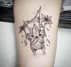 a black and white photo of a tattoo on the leg