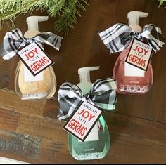 three hand soaps with christmas decorations on them