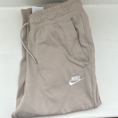 Beige Nike Joggers Sporty Neutral Bottoms For Spring, Nike Beige Cotton Bottoms, Beige Nike Cotton Bottoms, Nike Casual Beige Bottoms, Jordan Woman, Beige Nike, Tan Pants, Nike Joggers, Jordans Women