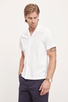 Made from breathable seersucker cotton blend fabric, it features a camp collar and short sleeves for a relaxed yet polished appearance. The relaxed fit provides all-day comfort, making it ideal for weekend outings or summer parties. With its versatile style, this shirt effortlessly transitions from day to night, ensuring you look and feel your best. Velvet Tees, Seersucker Shorts, Cotton Blend Fabric, Summer Parties, Short Sleeve Button Up, Versatile Style, Button Up Shirts, Button Up, Cotton Blend