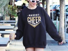 Cheer Sweatshirt, Personalized Cheer Team Sweatshirt, Cheer Template Sweatshirt, Custom Cheer Team Sweatshirt, Cheerleading Team Sweatshirt, Cheerleader Sweatshirt Welcome to TeeZoneUSA, where we offer a carefully curated collection of sweatshirts that seamlessly blend comfort and style. PRODUCT DETAILS: Our sweatshirts are crafted with a balanced mix of 50% cotton and 50% polyester, ensuring both coziness and durability. Our sweatshirts feature a medium-heavy fabric weighing 8.0 oz/yd², providing a snug and long-lasting fit. Additionally, they come with sewn-in labels for added comfort and easy identification. Choose from a variety of colors to express your unique style. SIZING GUIDE: Our sweatshirts are true to size with a loose fit, offering comfort without compromising style. Utilize o Casual Long Sleeve T-shirt For Cheerleading, Cheerleading Team, Team Sweatshirts, Cheer Team, Heavy Fabric, Cheerleading, Unique Style, Gender Neutral, Perfect Fit