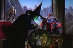 an animated scene with two people dressed as witches