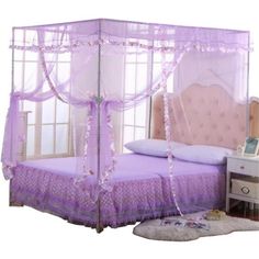 a bed with a pink canopy and purple bedspread