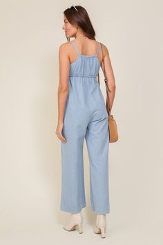 THE PERFECT MIX OF FLIRTY AND FUN, THIS JUMPSUIT IS READY FOR ANY SUMMER OCCASIONS. THE FLOWY SILHOUETTE IS COMPLEMENTED BY A SQUARE NECK LINE, RUCHED BUST, AND FRONT KEYHOLE DETAILS. WHETHER YOU ARE SIPPING COCKTAILS OR DANCING THE NIGHT AWAY, THIS DENIM BLUE JUMPSUIT WILL HAVE YOU FEELING THE BEST.* SLEEVELESS DESIGN* SPAGHETTI STRAP* SELF FRONT TIE* FRONT KEY HOLE* LIGHTWEIGHT MATERIAL* THE MODEL IS 5'9" AND WEARING SIZE SMALLMade In: ChinaFabric Contents: 90% cotton 10% viscoseSize Measureme Jumpsuit Fitted, Blue Jumpsuit, Jumpsuit Summer, Blue Jumpsuits, Sleeveless Jumpsuits, Denim Jumpsuit, Light Denim, Sheer Fabrics, Denim Fabric