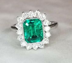 Gorgeous 14K WHITE GOLD ring Gem GREEN Colombia emerald. Center set Gem lab flux growth green Colombia emerald in emerald shape weight 1.75ct. size 8.5x7mm very nice rich vivid green color nice luster, lively ,nice cut,Sparkly emerald. side set 16 natural round diamonds total weight 0.64ct. H-VS Ring size 7.5 Retail Value $6,500 net Appraisal available Green Octagon Diamond Jewelry, Green Emerald Cluster Ring With Center Stone, Green Cluster Emerald Ring Vvs Clarity, Green Cluster Emerald Ring With Vvs Clarity, Cluster Emerald Ring With Vvs Clarity, Green Octagon Brilliant Cut Jewelry, Green Octagon Halo Setting Jewelry, Green Diamond Cluster Jewelry, Green Cluster Diamond Jewelry