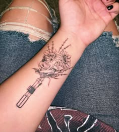 Star Wars Theme Tattoo, Star Wars Female Tattoo, Star Wars Tattoo Flowers, Wand And Lightsaber Tattoo, Sunflower And Rose Bouquet Tattoo, Flower Lightsaber Tattoo, Matching Star Wars Tattoo Couples, Pretty Star Wars Tattoo, Lightsaber With Flowers Tattoo