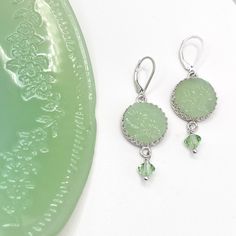 "Jadeite Fire King Earrings, Vintage Jadeite Plate, Jadeite Junkies, Broken China Jewelry, Unique Gifts for Women, Tassel Earrings Artfully repurposed vintage Fire King plate. Sterling Silver. Drop measures 1.50\". 5/8\" round jadeite charm. From top of ear wire to bottom of crystal is 2\" long. Extremely light weight and fluid, they move with you! Our modern make over of this 1940's classic is a must have for every jadeite collector. Charming handcrafted earrings feature this fabulous Alice jad Vintage Jadeite, Broken China Jewelry, Vintage Fire King, China Jewelry, Repurposed Vintage, Broken China, Unique Gifts For Women, Cameo Necklace, Anniversary Jewelry