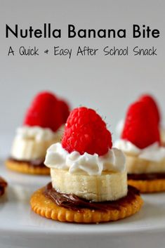 three mini desserts with whipped cream and raspberries on top