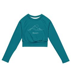 Mountain Wanderer Blue Crop Top Sporty Crew Neck Tops For Adventure, Fitted Athleisure Tops For Outdoor, Blue Moisture-wicking Activewear For Outdoor Activities, Blue Activewear For Outdoor With 4-way Stretch, Blue Crew Neck Top For Outdoor Activities, Blue Long Sleeve Hiking Tops, Blue Long Sleeve Top For Hiking, Sporty Long Sleeve Tops For Hiking, Blue 4-way Stretch Activewear For Outdoor