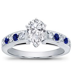 a diamond and blue sapphire engagement ring