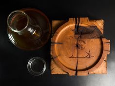 a wooden coaster and glass on a table