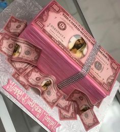 a cake made to look like a pink money box with diamonds on the front and sides