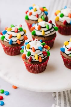 chocolate cupcakes with white frosting and christmas lights