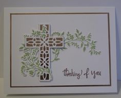 a card with a cross and vines on it