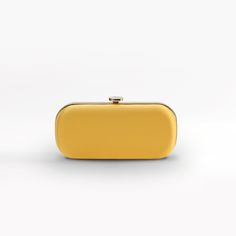 The Limoncello Yellow Bella Clutch is a bold yellow bridal handbag, crafted with duchess satin by Italian artisans featuring a lively pop of color. Planning a maximalist wedding day or looking to make a powerful statement at your next gala? Inspired by Italy’s Amalfi Coast, a coastline featuring terraced vineyards and cliffside lemon groves, this luxury handbag will make a statement on your wedding day, at a red-carpet affair, or on a tropical destination trip. First seen on celebrity stylist Mi Maximalist Wedding, Bridal Handbag, Red Carpet Affair, Lemon Grove, Celebrity Stylist, Frame Fabric, Bridal Handbags, Yellow Satin, Duchess Satin