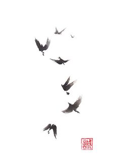 a flock of birds flying in the sky with chinese characters on it's side