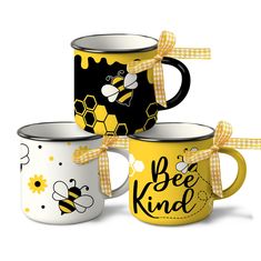 three coffee mugs with bees on them and the words be kind printed on them