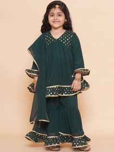 Light, breathable and beautiful sharara set shall definitely be her go-to ethnic pick for any festive occasion. The flared sharara and Kurta are made in cotton, adorned with ornamental laces. The relaxed silhouette and natural material ensure the utmost comfort for the little one, so the best smile is always on. Care Instructions: Hand Wash Only Fit Type: Regular Sale Package: 1 Kurta, 1 Sharara Fabric Details :-  Kurta - Georgette, Sharara - Georgette Kurta Features - Floral Pattern, Full Sleev