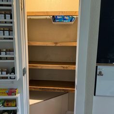 an open pantry door with food in it