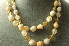 Vintage Layered Beaded Necklace. This soft colored beaded necklace features a double strand of multicolored beads, including light yellow, cream(beige), white and clear. Hook closure with extender. A lovely mid century necklace. Circa 1960's Unmarked Length - 18 inches with extender up to 21 inches Very good condition Vintage Beige Beaded Necklace, Vintage Beaded Beige Necklace, Vintage Beige Round Beads Necklace, Vintage Cream Beaded Handmade Necklaces, Vintage Handmade Cream Beaded Necklaces, Beige Beaded Necklaces With Round Beads, Beige Beaded Necklace With Round Beads, Vintage Cream Necklaces With Round Beads, Vintage Cream Necklace With Round Beads