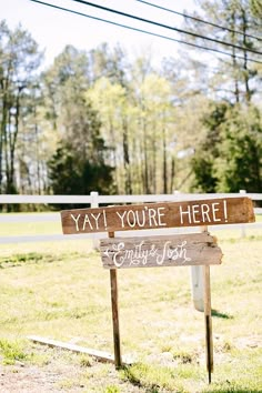 a wooden sign that says yay you're here